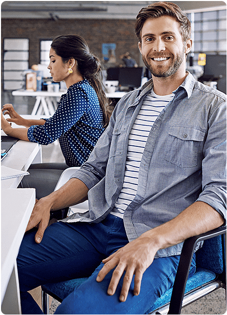 A professional smiling man sitting in an office. Best Digital Marketing Agency in Hyderabad