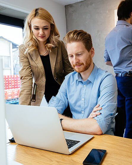 A man and women discussing on a project. About us the brand elevate